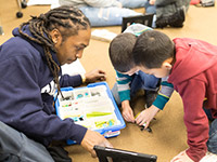 Man interacting with students